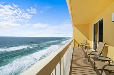 a balcony with chairs and a view of the ocean at Calypso 2201E 3BR 3BA corner unit 2 sets of beach chairs in Panama City Beach