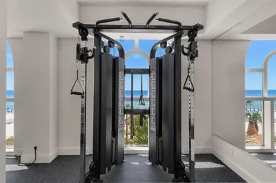 a row of treadmills in a room with windows at Calypso 2006W Gulf Front and Newly renovated Custom Shower in Panama City Beach
