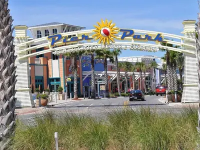 a large entrance to a amusement park with a sign at Calypso 2006W Gulf Front and Newly renovated Custom Shower in Panama City Beach