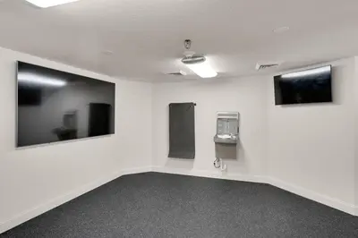 an empty room with white walls and mirrors at Calypso 1801W Corner Unit Incredible wrap around Balcony in Panama City Beach