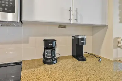a coffee maker sitting on a counter in a kitchen at Grand Panama 407 in Panama City Beach
