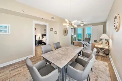 a dining room with a table and chairs at Grand Panama 501 in Panama City Beach
