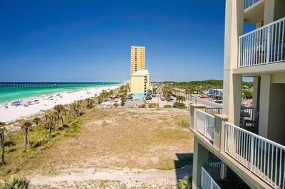 a view of the beach from a balcony of a resort at Grand Panama 501 in Panama City Beach