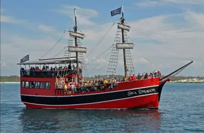 a group of people on a pirate ship in the water at Grand Panama 501 in Panama City Beach
