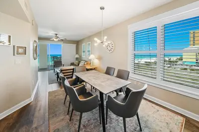 a dining room with a table and chairs at Grand Panama 501 in Panama City Beach