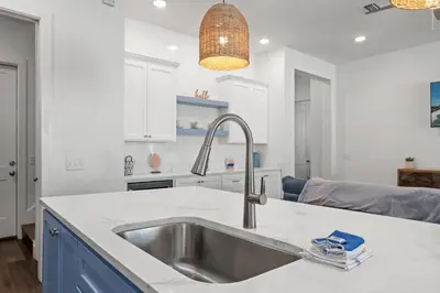 a kitchen with a sink and a counter top at Laid-Back - Private Pool, 4 Min Walk to Beach, Close to 30A, FREE Daily Activities in Panama City