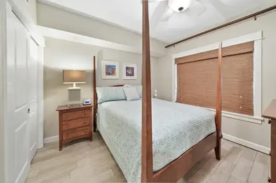a bedroom with a bed and a window at Grand Panama 904 in Panama City Beach