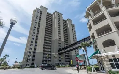 a large building with a stop sign in front of it at Grand Panama 909 in Panama City Beach