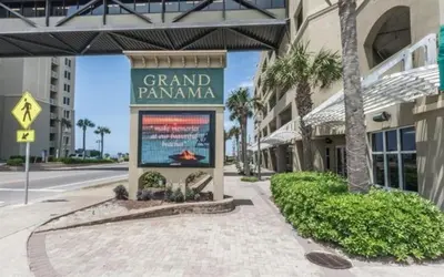 a sign for a grand pamma on the side of a building at Grand Panama 909 in Panama City Beach