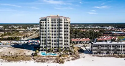 an aerial view of a tall building on the beach at Grand Panama 909 in Panama City Beach