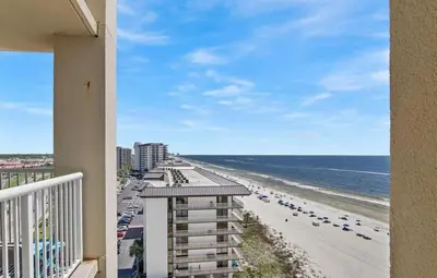 a view of the beach from the balcony of a condo at Grand Panama 909 in Panama City Beach