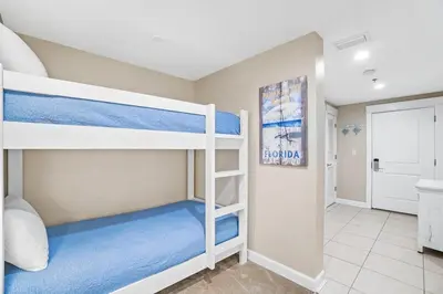 a bedroom with two bunk beds in a room at Grand Panama 1003 in Panama City Beach