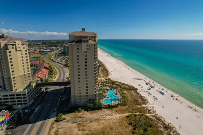 an aerial view of a beach and a building at Grand Panama 1204 in Panama City Beach