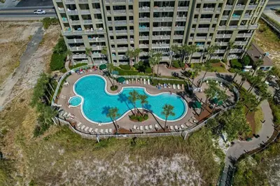 an aerial view of a large building with a swimming pool at Grand Panama 1204 in Panama City Beach