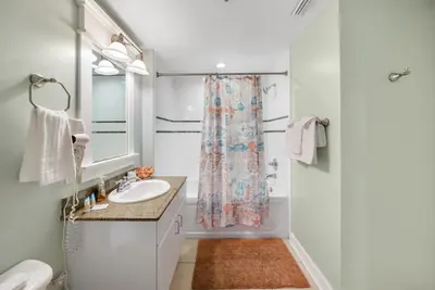 a bathroom with a sink and a shower at Grand Panama 1406 in Panama City Beach