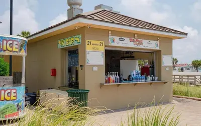a small building with a store in the street at Grand Panama 1408 in Panama City Beach