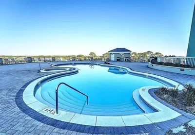 a large swimming pool with stairs around it at Grand Panama 1408 in Panama City Beach