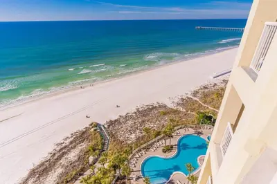 a view of the beach from the balcony of a condo at Grand Panama 1508 in Panama City Beach
