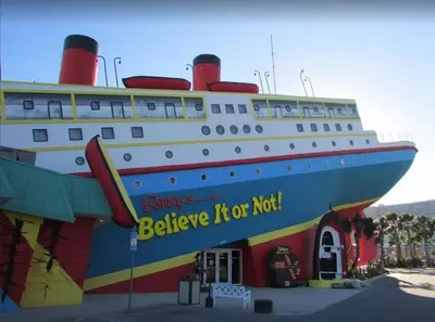 a large cruise ship parked next to a building at Grand Panama 1508 in Panama City Beach