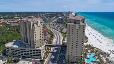 an aerial view of a beach and buildings at Grand Panama 1801 in Panama City Beach