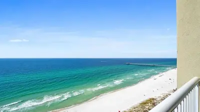 a view of the ocean from a balcony of a beach at Grand Panama 1801 in Panama City Beach