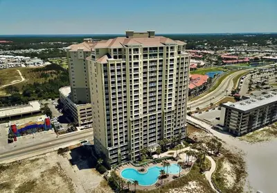 an aerial view of a large building with a pool at Grand Panama 1806 in Panama City Beach