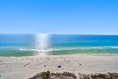 a group of people on a beach near the ocean at Grand Panama 2004 in Panama City Beach