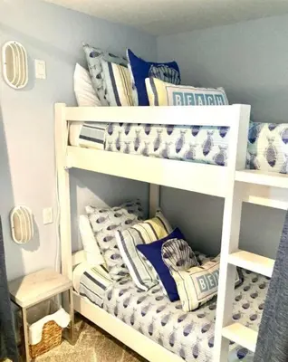 two bunk beds in a room with pillows at Grand Panama 2009 in Panama City Beach