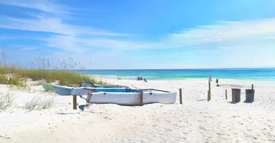 a group of boats sitting on the beach at Sterling Breeze 202 in Panama City Beach