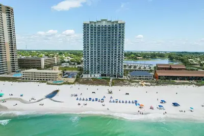 an aerial view of a beach with people on it at Sterling Breeze 202 in Panama City Beach