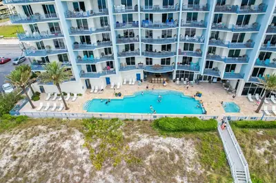 an aerial view of a large apartment building with a swimming pool at Sterling Breeze 202 in Panama City Beach