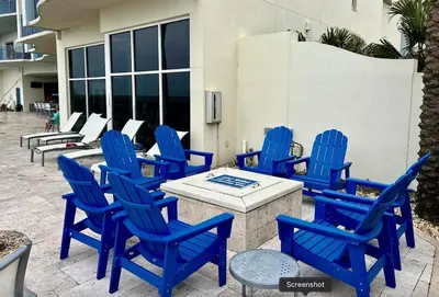 a group of blue chairs sitting on a patio at Sterling Breeze 401 in Panama City Beach