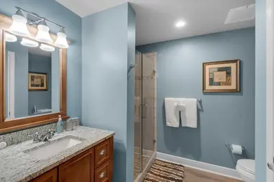 a bathroom with a sink and a shower at Sterling Breeze 401 in Panama City Beach
