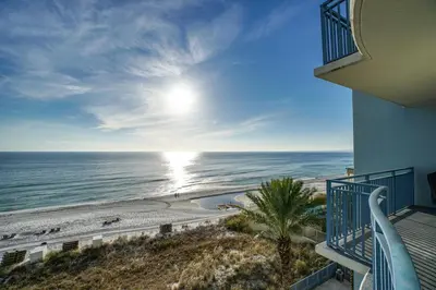 a view of the ocean from a balcony of a condo at Sterling Breeze 406 in Panama City Beach