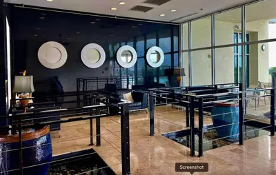 a room with four mirrors on the wall in a building at Sterling Breeze 406 in Panama City Beach
