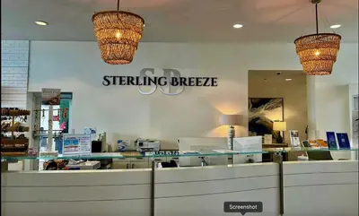 a store with two chandeliers hanging above a counter at Sterling Breeze 1506 in Panama City Beach