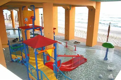 a water park with a water slide on the beach at Splash 707E in Panama City Beach