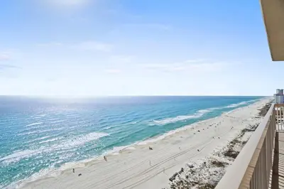 a view of the beach from the balcony of a condo at Sunrise 1611 in Panama City Beach