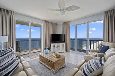 a living room with a couch and a flat screen tv at Sunrise 2011 in Panama City Beach