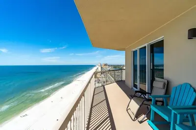 a balcony with two chairs and a view of the beach at Sunrise 2011 in Panama City Beach