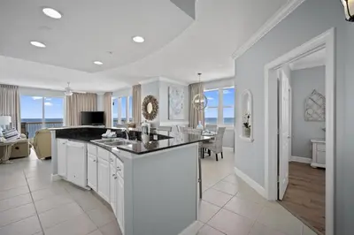 a kitchen with a large island in a living room at Sunrise 2011 in Panama City Beach