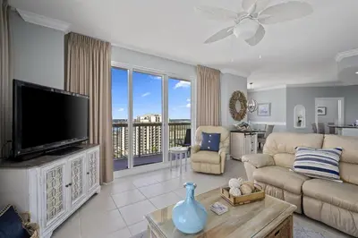 a living room with a tv and a couch at Sunrise 2011 in Panama City Beach