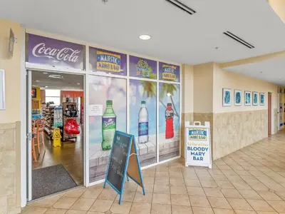 a store with a coca cola sign on the wall at Gulf views, beachfront, Majestic Beach Resort in Panama City Beach