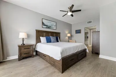 a bedroom with a bed and a ceiling fan at Gulf views, beachfront, Majestic Beach Resort in Panama City Beach