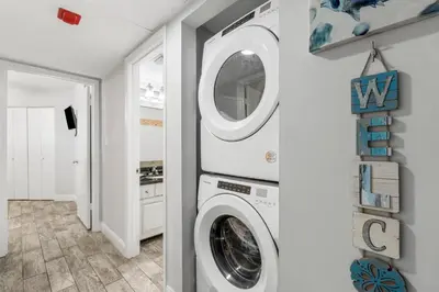 a laundry room with a washer and dryer at Aquavista E406 in Panama City Beach
