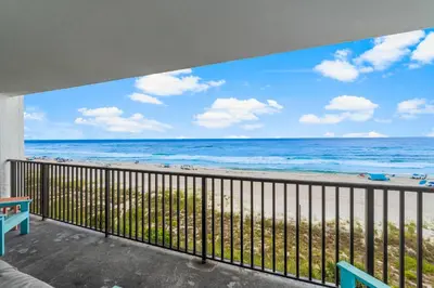 a balcony with a view of the beach at Aquavista E406 in Panama City Beach
