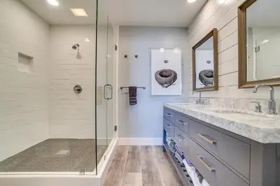 a bathroom with a shower and a sink and a mirror at Ramsgate 22 Premium Quality One level Fully Renovated in Panama City Beach