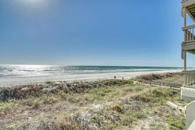 a view of the beach from the balcony of a beach house at Ramsgate 22 Premium Quality One level Fully Renovated in Panama City Beach