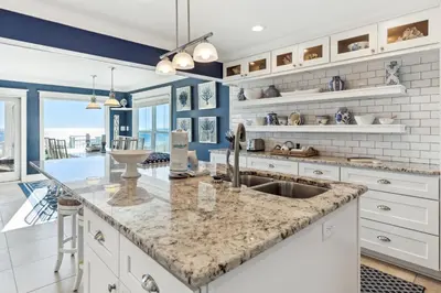 a kitchen with a sink and a counter top at Spring Break Promo! Gulf Front Home with Private Beach Access with Bikes! in Inlet Beach