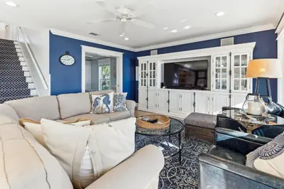 a living room with a couch and a tv at Spring Break Promo! Gulf Front Home with Private Beach Access with Bikes! in Inlet Beach